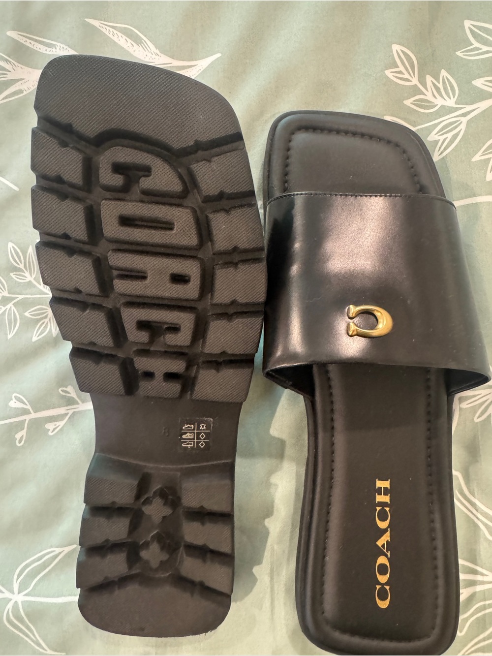 Coach Black Leather Slide Mules with Gold 'C' Accent